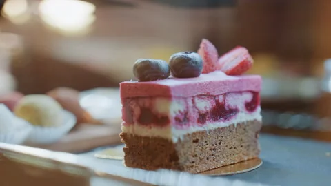 Warm dessert presentation with shadows. Intimate bistro setting featuring Stock Footage 335401342