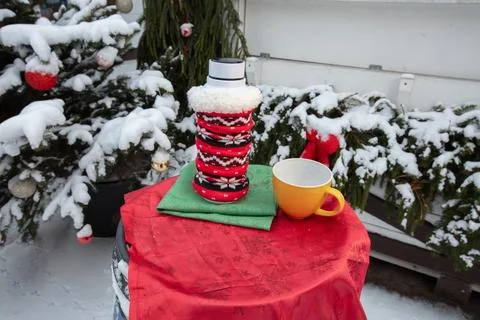 Warm drink setup on a table in the snow during winter with a festive atmosp.. Stock Photos