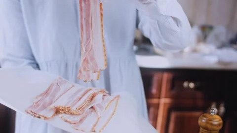 Warm dynamic preparation: rolling pork tenderloin into a compact roast Stock Footage 342184588