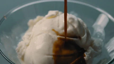 Warm espresso poured onto vanilla ice cream Stock Footage 274644840