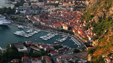 Warm Evening Light on Old Town Roofs and Walls Aerial Drift Stock Footage 345529612