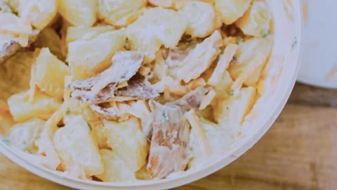 Warm fine dining angle: arranging the loaded potato salad Stock Footage 342198878