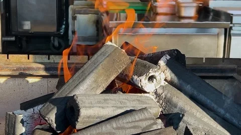 Warm fire burning on a grill. Logs glowing with orange flames. Stock Footage 328600468