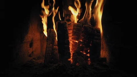 Warm fire in a home fireplace in winter. Woods are burning slowly. Relaxing cozy Stock Footage 86727823