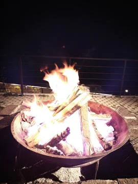 Warm Firelight From a Bonfire on a Chilly Mountain Evening Stock Photos