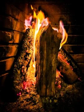 Warm Fireplace with Burning Logs Stock Photos