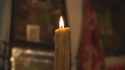 Warm flame of a wax candle close up Stock Footage 145375459