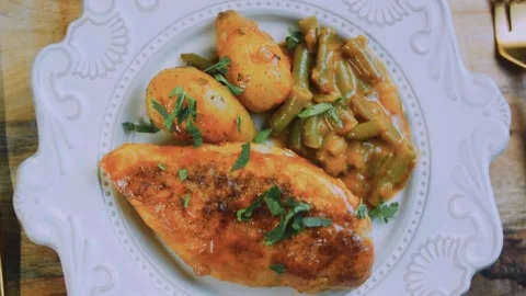 Warm fresh assembly: serving honey mustard chicken with roasted vegetables Stock Footage 342180899