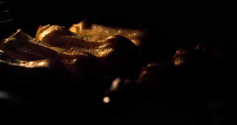 Warm fresh eclair in a bakery. Time lapse footage of cooking. Stock Footage 138097522