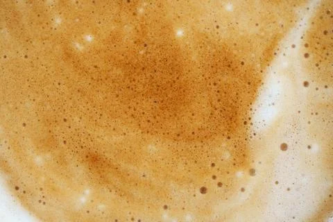 Warm frothy coffee surface experience. Warm brown coffee foam with delicate bubb Stock-Fotos
