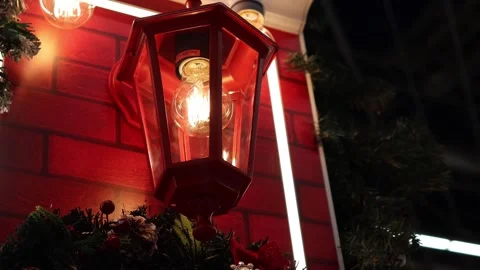 Warm glow from a charming lantern illuminating a festive evening 스톡 동영상 296145193
