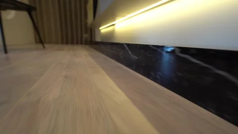 Warm Glow on Polished Surfaces. Laminate-Sleek Inviting Video stock 309511007