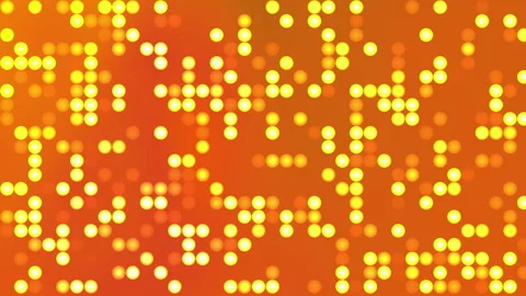 Warm glowing dots pulse across an orange gradient background 库存影片 332405211