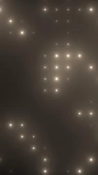 Warm glowing light particles scattered across a dark smoky background, crea.. Stock Photos