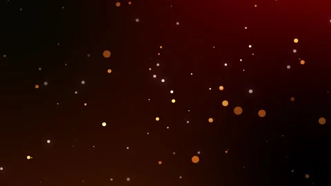 Warm glowing particles gently float across a dark red gradient background Stock Footage 309118008