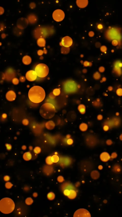 Warm gold sparkle bokeh visual with orange circles, soft blur, and dark elegant 動画素材 340556414