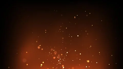 Warm golden particles floating on dark orange background Stock Footage 330297267