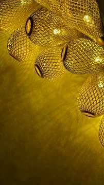 Warm golden string lights with a beautiful metallic mesh texture creating a.. Stock Photos