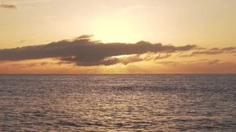 Warm golden sunset casting dramatic light over Atlantic Ocean coastline near 스톡 동영상 308402910