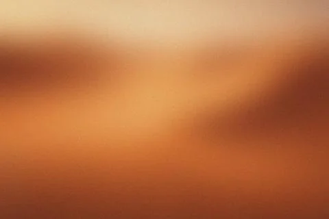 Warm gradient hues blend softly across the frame. Faint textures suggest de.. イラスト素材