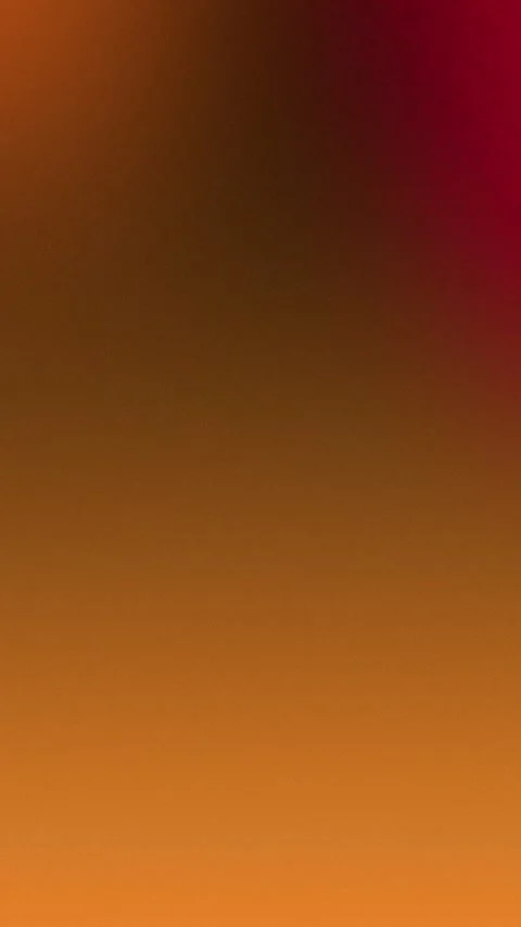 Warm gradient with orange and red tones, seamless loop background. 4K. Stockbeeldmateriaal 309856210