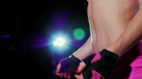 Warm up before a hard workout. Female hands in gloves do exercises to warm up Stock Footage 66261456