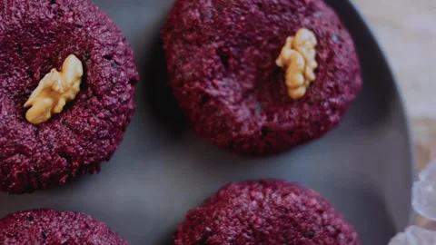 Warm ingredient arrangement: capturing walnut and beet texture Stock Footage 342200441