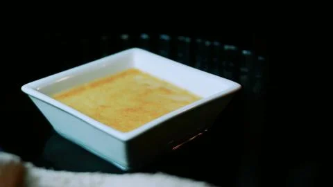 Warm ingredient study of baked flan resting on the oven rack Foto stock