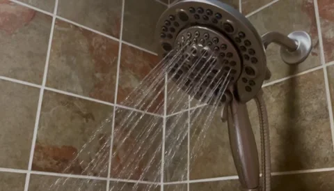 Warm Invigorating Shower Time with Detachable Shower Head Stock Footage 275620042