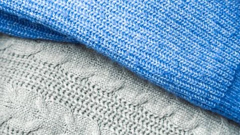 Warm knitted sweaters concept representing cozy winter wardrobe and cold seas Stock Photos