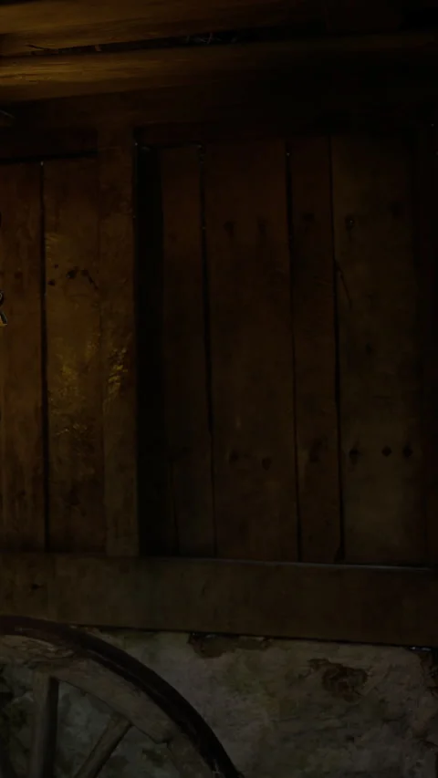 Warm lantern light glows softly in a rustic wooden barn at twilight hours Stock Footage 331810342