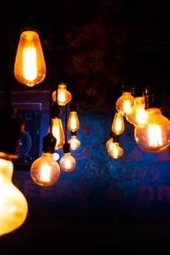 Warm light bulbs with blue background Stock Photos
