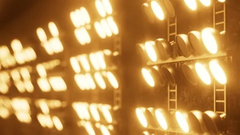 Warm light emitting from spotlights array on a metal structure Stock Footage 315988373