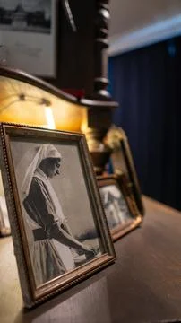 Warm light glows behind framed photos Stock Photos