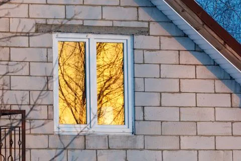 Warm light glows through window frame Stock Photos