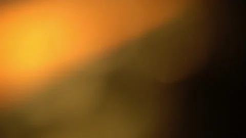 Warm light leaks background effect. Classic yellow light leak in 4k. 動画素材 198531640