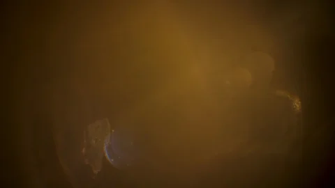 Warm light revealing different shapes on old glass Stock Footage 106435918