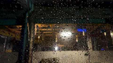 Warm light through rainy windshield Stock Footage 326238020
