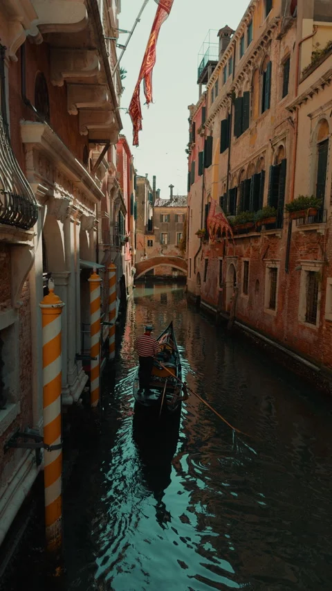 Warm light on Venice canal between old buildings Stock Footage 336712096