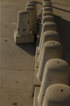 Warm lighting enhances texture and depth of urban border elements 库存照片