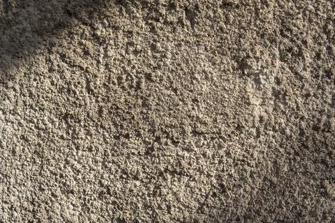 Warm limestone texture. gray concrete wall with rough texture. Stock Photos