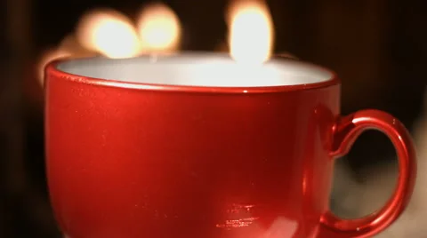 Warm mug of hot coffee by the fireplace Stock Footage 61842399