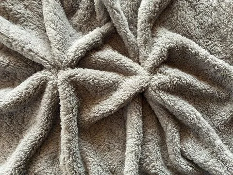 Warm Neutral Textile Texture With Soft Draped Folds 库存照片