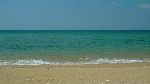 Warm Ocean Water laps at Coarse Sand on a Tropical Beach Stock-Footage 63345613