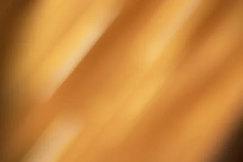 Warm orange abstract blur with soft diagonal light, creating a cozy, energetic Stock Photos