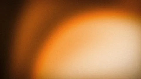 Warm orange brown beige gradient grainy textured abstract background 4K dig.. Stock Photos