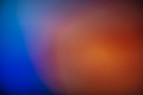 Warm orange gradient background with smooth transitions to deep Stock Photos