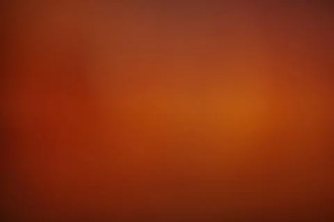 Warm orange gradient background with smooth transitions to deep Stock Photos