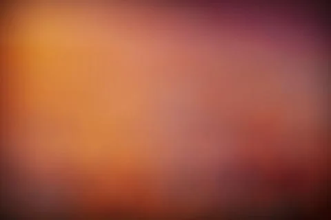 Warm orange gradient background with smooth transitions to deep Stock Photos