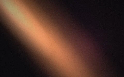 Warm orange light beam on a dark grainy background, with soft glowing, grad.. Stock Photos